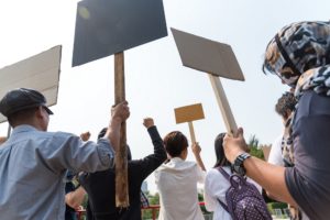 Protesters Holding Signs