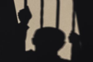 Prisoner Shadow Projected on Wall