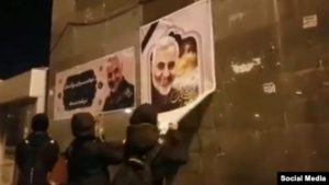 iran-protesters-tear-down-qasem